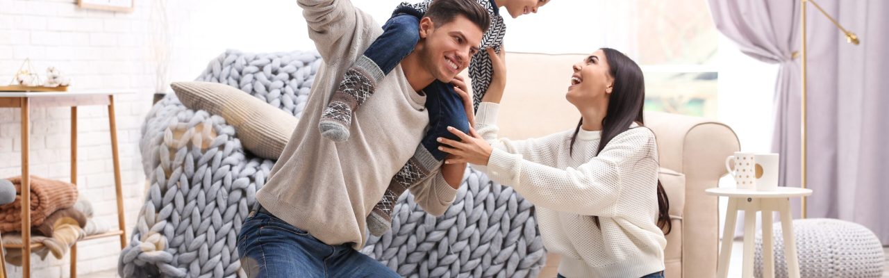 Happy family with little son having fun at home. Winter vacation